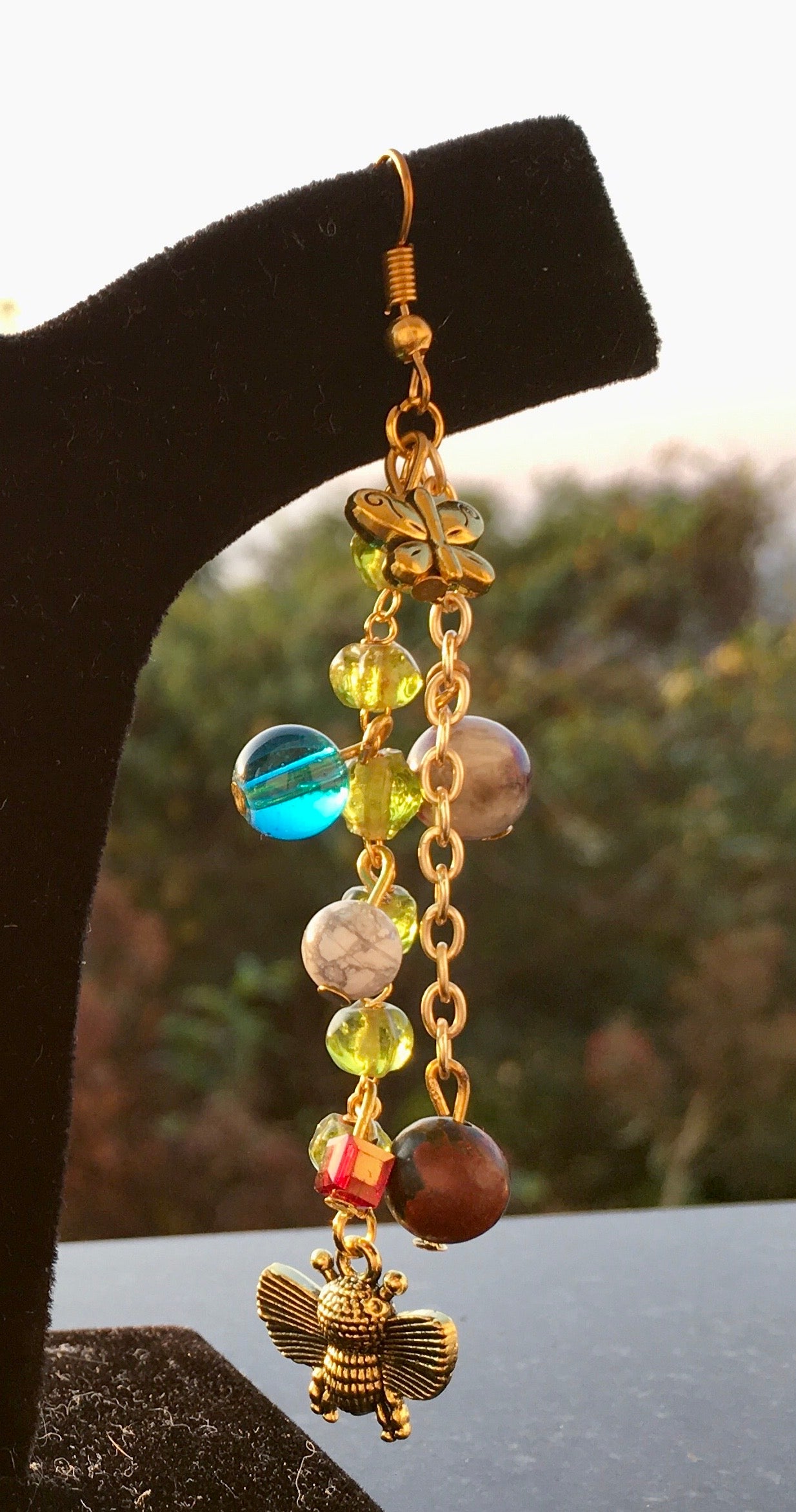 Bring a smile and reminisce of childhood joy, with soothing Howlite and jasper. Accompanied by the adorable teddy bear accent. Howlite represents calmness and sereniEarringsSpectakUrsa Oasis