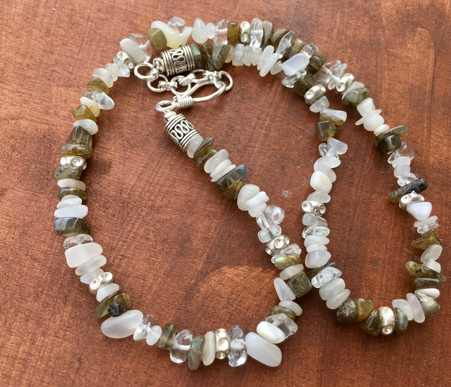 Unlock the mystical powers of Labradorite and Moonstone with our enchanted necklace. Labradorite’s iridescent luminosity evoke the Northern Lights or perhaps a peacoNecklacesSpectakGalactic Goddess