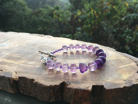 May this African amethyst bracelet, clear your mind and help you to find serenity and happiness in all things. With its mesmerizing violet hues, amethyst symbolizes BraceletsSpectakPurple Cloud