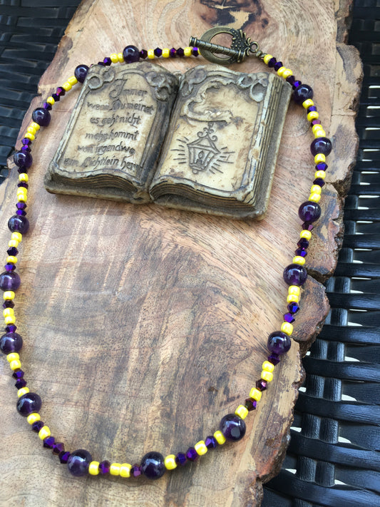 Amethyst crystal and yellow glass beads unite in this stunning necklace, blending luxury with warmth. Amethyst’s calming properties meet the vibrant energy of yellowNecklacesSpectakPurple Heart