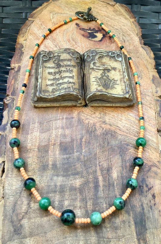 Embark upon a journey to the African savannah with this enchanting necklace. African turquoise is revered for its ancient wisdom, combined with orange glass beads thNecklacesSpectakTurquoise Treasure