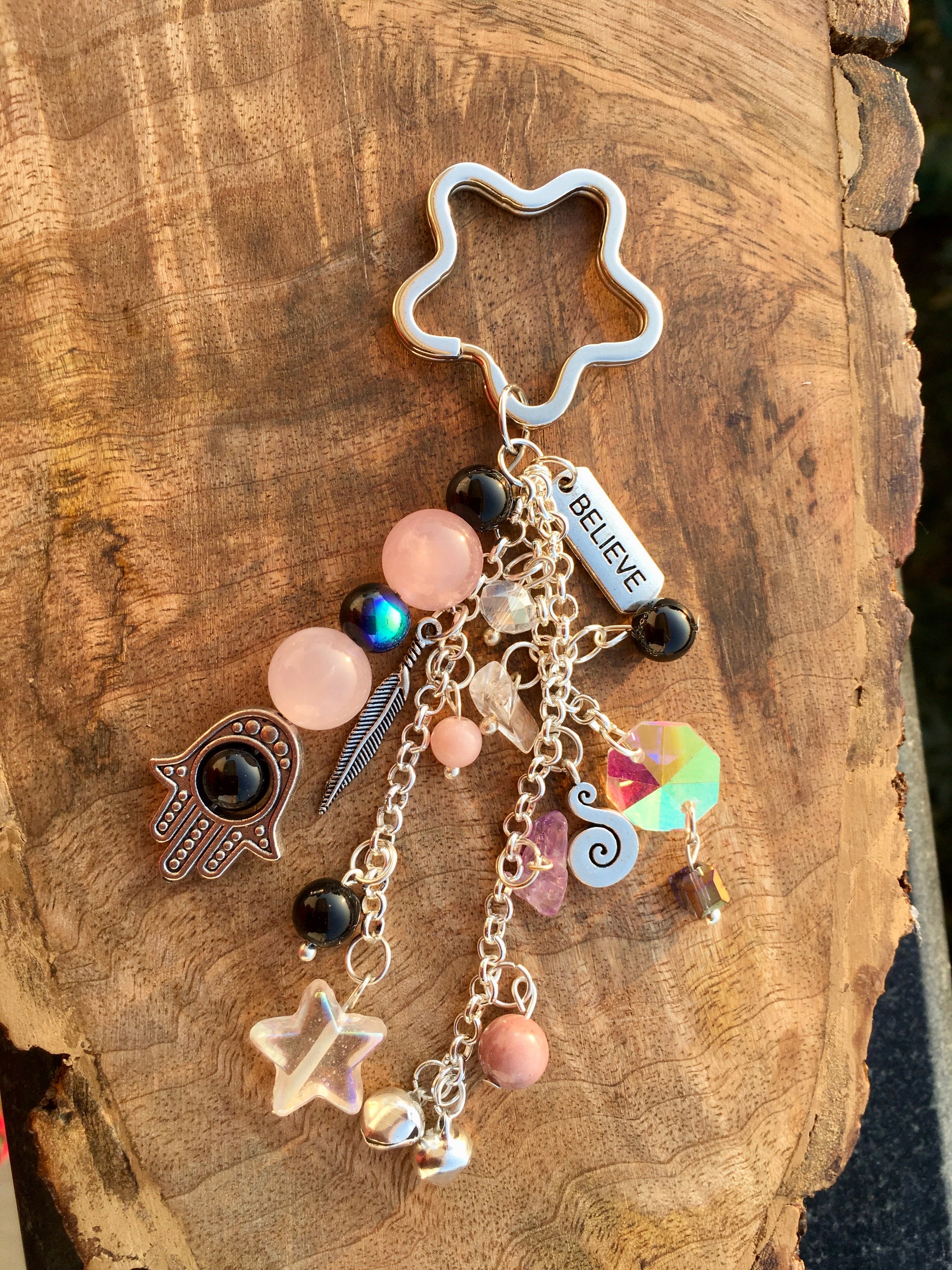 Protect your heart and attract loving energy with our Rose Quartz Hamza Evil Eye keychain. This stunning piece combines the calming properties of Rose Quartz with thKeychainSpectakHamza Forever