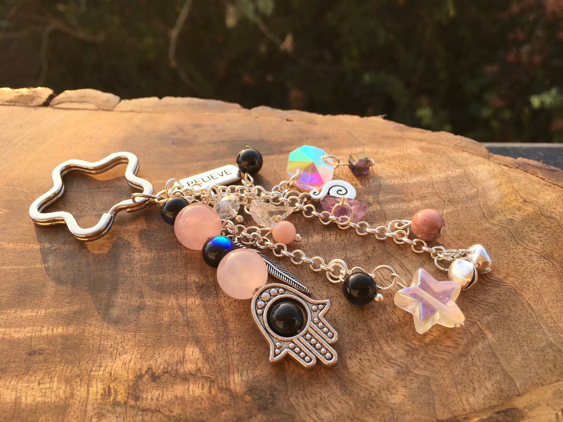 Protect your heart and attract loving energy with our Rose Quartz Hamza Evil Eye keychain. This stunning piece combines the calming properties of Rose Quartz with thKeychainSpectakHamza Forever