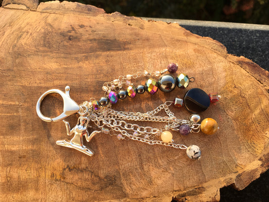 Add our meditative multi crystal bag charm to your favorite bag and carry the spirit of connection and joy through your day.Bag charmSpectakCelestial Hush
