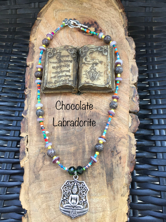Connect with your inner Buddha and discover the peace and tranquility within you. Chocolate labradorites deep earthy tones ground your spirit, while the Buddha pendaNecklacesSpectakMindful muse
