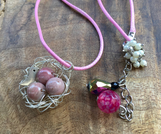 This delicate nest pendant cradles 3 Rhodochrosite beads, symbolizing love, nurturing, healing and protection.The intricate nest is carefully crafted to resemble twiNecklacesSpectakLove Nest