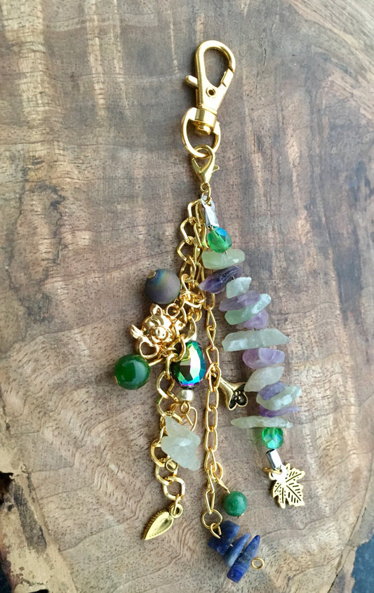 Explore the transformative power of multiple crystals with this beautiful , one of a kind bag charmBag charmSpectakCrystal Cluster