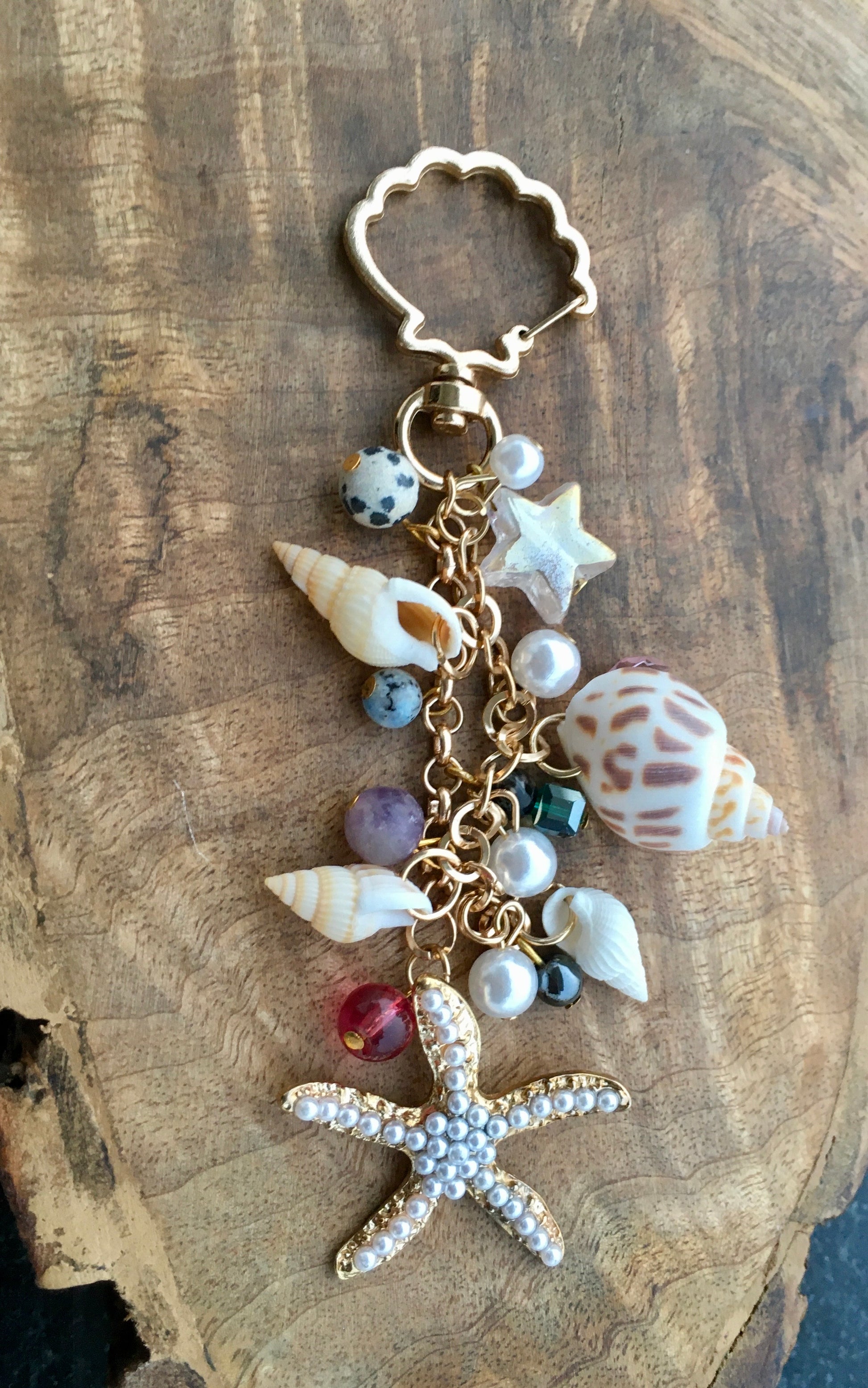 Embrace the essence of goa, with this beautiful  keychain. Made with genuine shells and crystals, this charming accessory adds a touch of bohemian charm to your keysKeychainSpectakBohemian Rhapsody