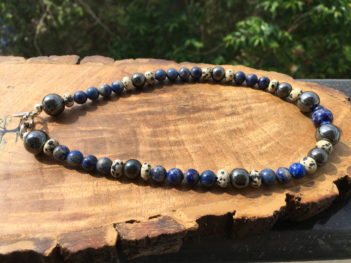 Embody the powerful energies of Hematite, Lapis lazuli and Dalmatian Jasper with this amazing necklace.
Hematite grounds, protects and promotes inner strength and peNecklacesSpectakMindful Warrior