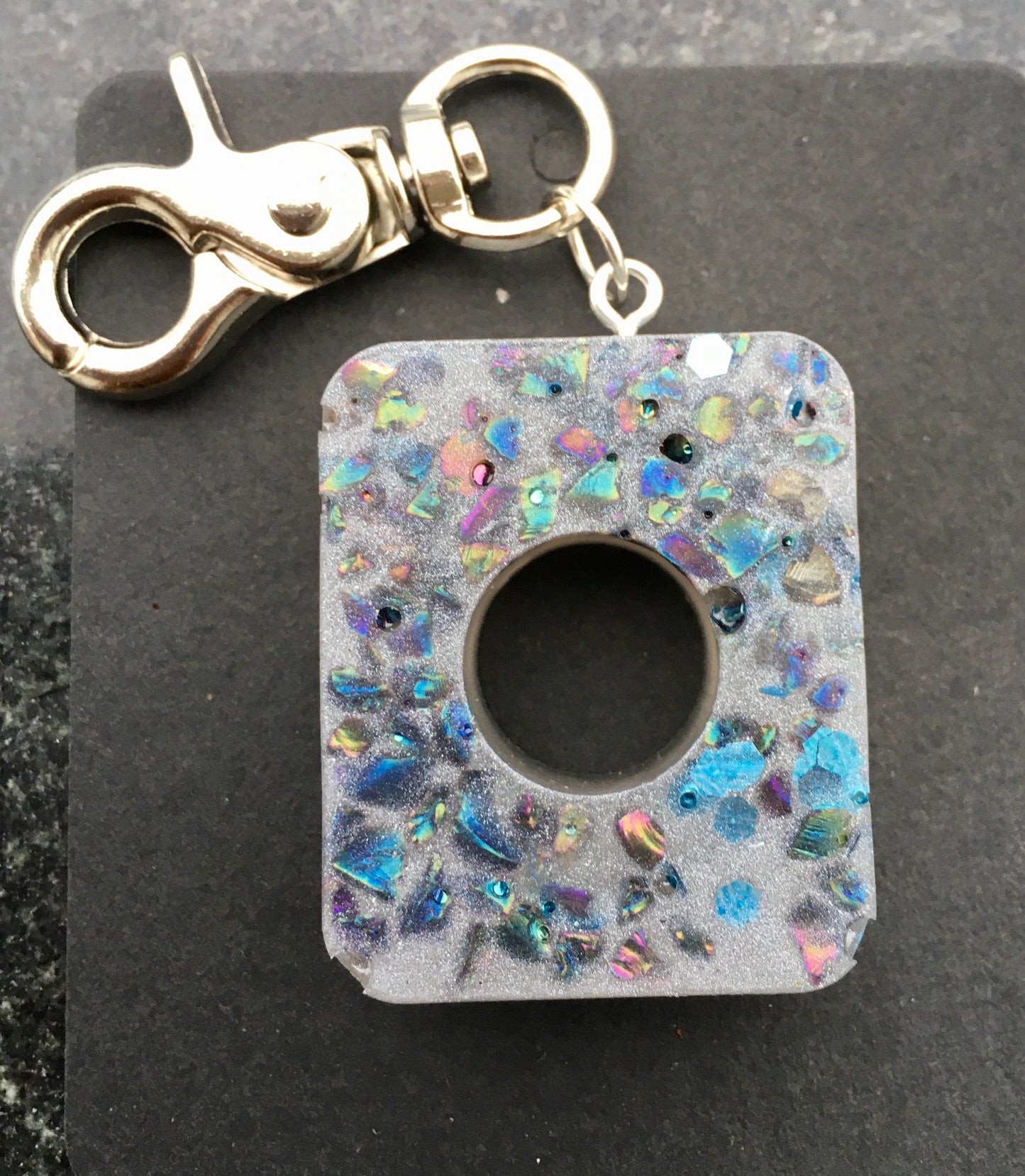 Record and cherish life’s precious moments with our symbolic RECORD keychain, made with crystal chips.KeychainSpectakMemory Record Keeper