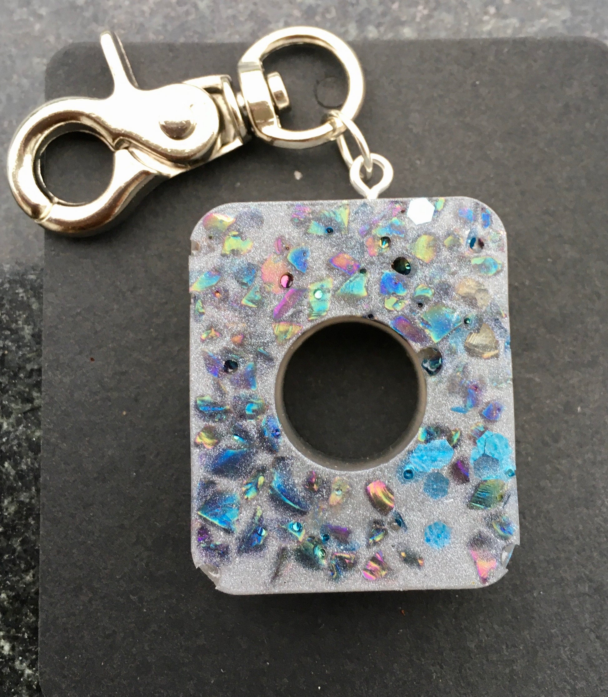 Record and cherish life’s precious moments with our symbolic RECORD keychain, made with crystal chips.KeychainSpectakMemory Record Keeper